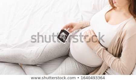 Stock photo: Maternity Concept - Expectant Young Woman With Sonography Photo