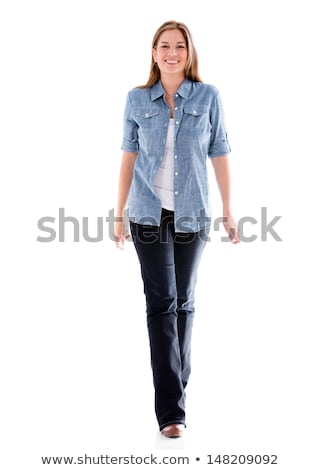 Zdjęcia stock: Happy Young Casual Woman Walking Forward And Smiles