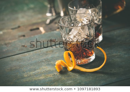 Stock fotó: Alcoholic Cocktail With Orange Peel And Ice