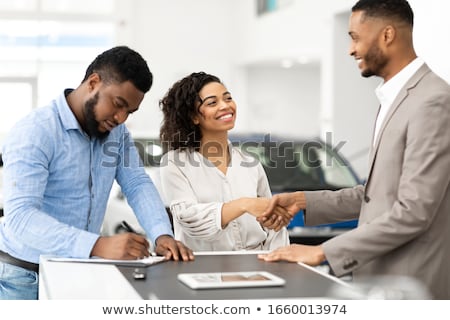Foto stock: Customer And Salesman At Car Service Or Auto Store