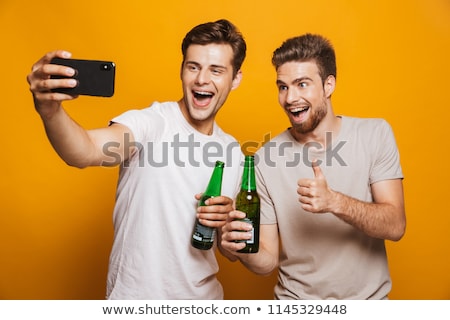 Zdjęcia stock: Male Friends With Bottles Of Drink