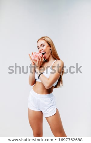 Stock fotó: Excited Hungry Young Woman Isolated Over Pink Wall Background Holding Cake