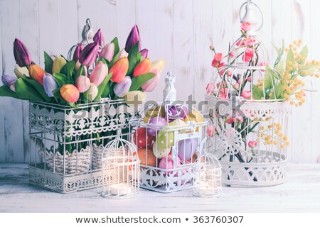 Foto stock: Spring Flowers And Easter Decorations On Shabby Chic Background