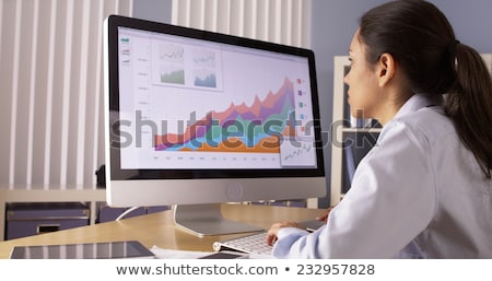 Foto stock: Businesswoman Looking At Computer Screen On Desk