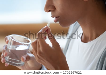 [[stock_photo]]: Taking Supplements