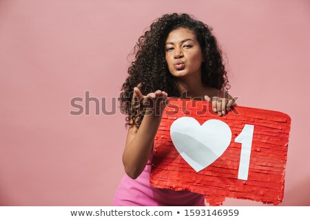 Stockfoto: Image Of Nice African American Woman Holding Placard And Sending Air Kiss