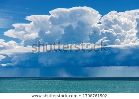 Stock fotó: The Sky And The Sun In Clouds Above A Gulf