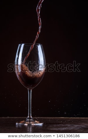 ストックフォト: Red Wine Being Poured Into A Glass