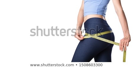 [[stock_photo]]: Slim Woman With A Tape Measure Isolated On White Background