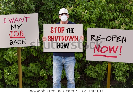 Stockfoto: A Man In A Medical Mask Protests