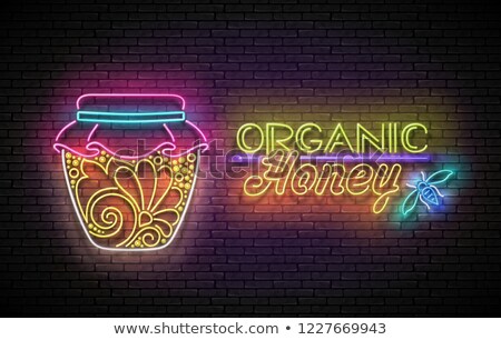 Stok fotoğraf: Vintage Glow Poster With Jar Of Organic Honey And Inscription
