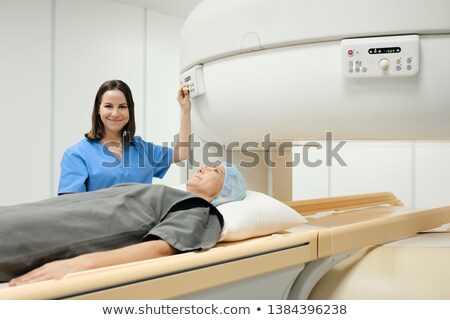 Stockfoto: Portrait Of Friendly Successful Doctor Smiling At Camera During Mri