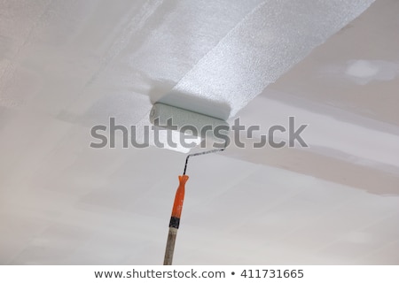 Stock fotó: A Man Painting The Ceiling