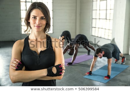 Zdjęcia stock: Aerobic Pilates Personal Trainer In A Gym Group Class