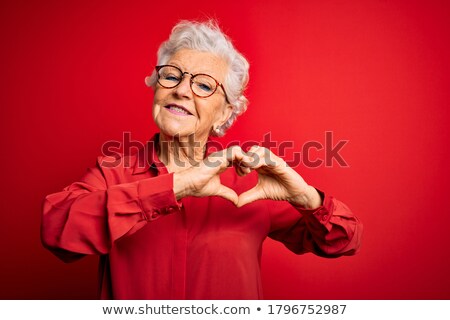 Foto stock: Lovely Woman Showing Heart Shape