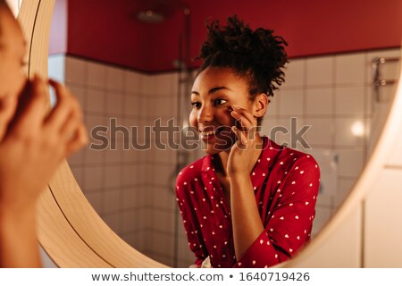 Foto stock: Woman With Great Makeup And Face Cream