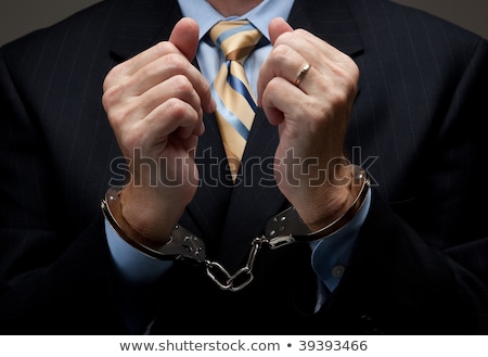 Foto stock: Arrested Man With Cuffed Hands In Front