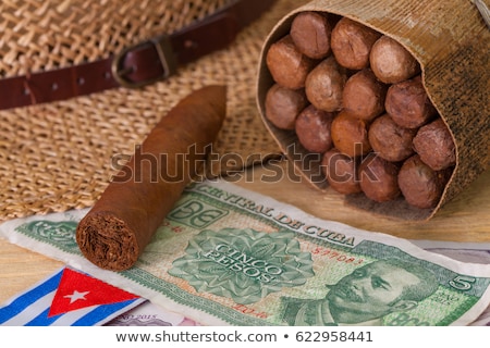 Foto stock: Siesta - Cigars Straw Hat And Cuban Banknotes