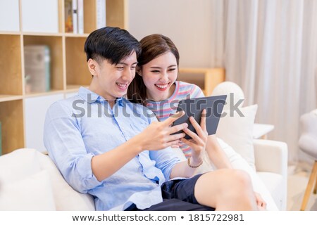 Stock photo: Couple Happily Browsing The Internet