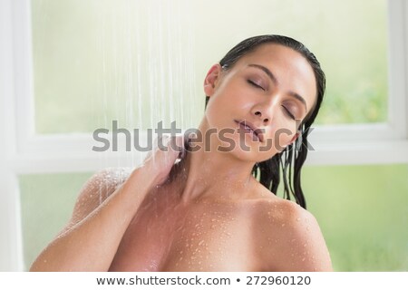 Stock foto: Young Brunette Woman Is Taking Shower