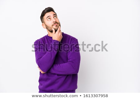 Foto stock: Young Man In Thoughts Against A White Background