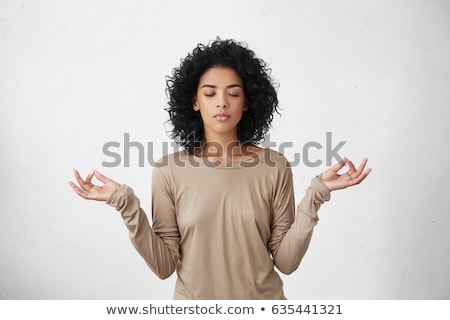 Stock fotó: Woman Sitting In Lotus Position With Eyes Closed