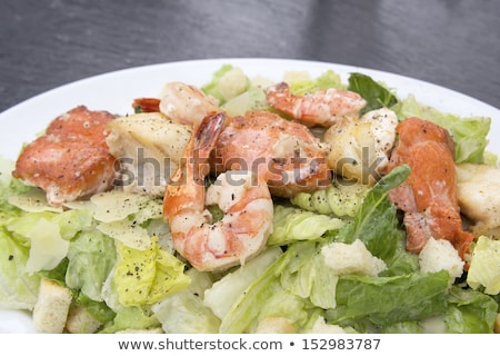 Stock photo: Caesar Salad With Prawns Salmon And White Fish Closeup