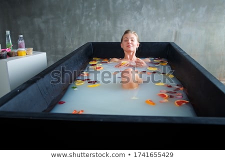 Stock photo: Black Woman Petal Roses Bath
