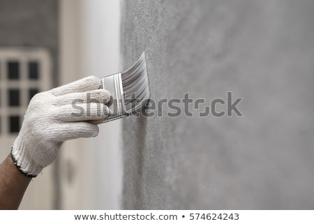 Stok fotoğraf: Painter With Brush And Paint On Construction Site