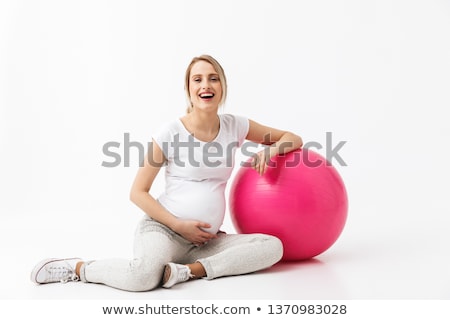 Stok fotoğraf: Woman Exercising With Ball Isolated On White