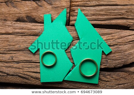 Stock foto: Closeup Of Rings On Broken Model House