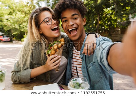 Сток-фото: Cheery Young Multiethnic Couple Spending Time Together