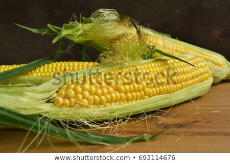 Foto stock: Corn Cobs And Seeds On Wooden Table