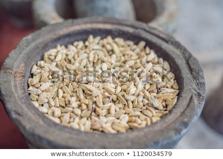 Stockfoto: Pods Of Green Cardamom In A Large Pottery