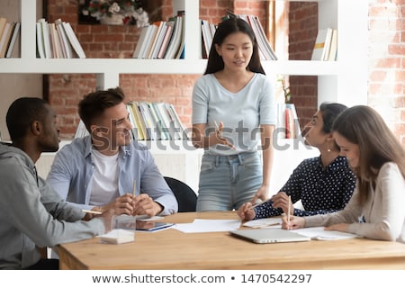 Stock foto: Teacher And Students Working Together In A Group Or Team Session