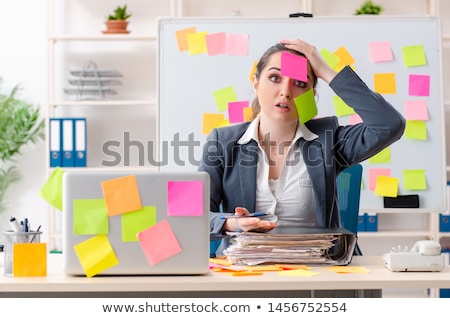 Stock photo: The Young Female Employee In Conflicting Priorities Concept