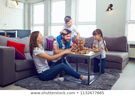 [[stock_photo]]: Family Playing A Game