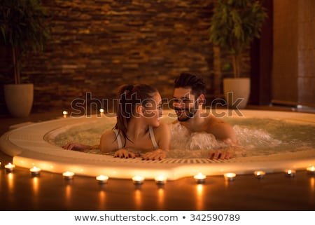Stock photo: Young Couple In Jacuzzi