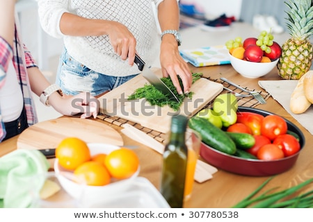 Stok fotoğraf: Young Woman Preparing Lunch