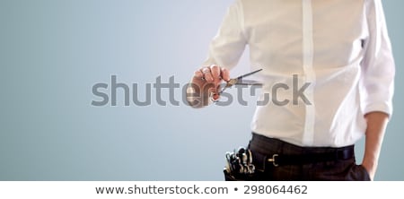 Stok fotoğraf: Close Up Of Male Stylist With Scissors Over Blue