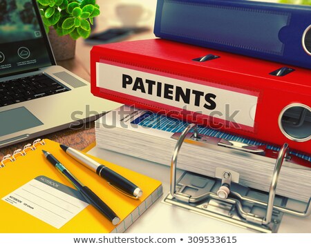 Foto stock: Red Office Folder With Inscription Patients
