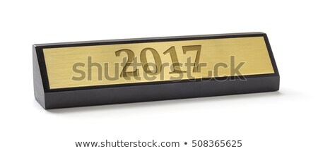 Foto stock: A Name Plate On A White Background With The Engraving 2017