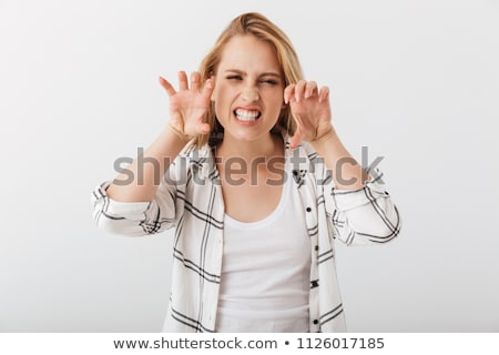 [[stock_photo]]: Portrait Of A Young Casual Girl Making Cat Claw Gesture