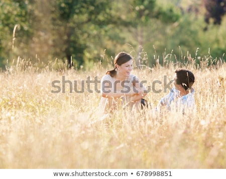 Stockfoto: Smiling Couple Relaxing In Wheatfield