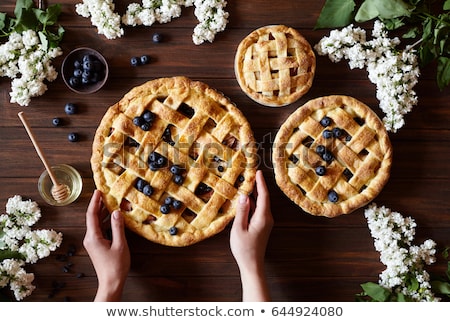 Foto stock: Homemade Pastry Apple Pie With Bakery Products On Dark Wooden Kitchen Table