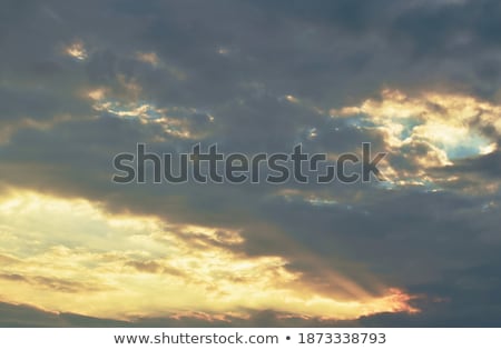 Stok fotoğraf: Vast Blue Sky With Big White Fluffy Clouds Lighted Sun