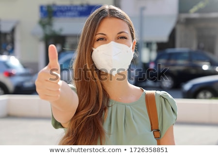 Zdjęcia stock: Optimistic Young Woman Showing Thumbs Up