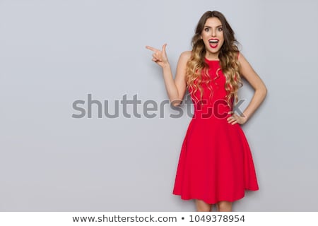ストックフォト: Attractive Young Woman In A Red Dress