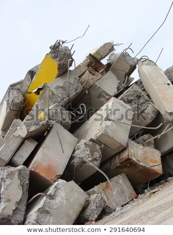 [[stock_photo]]: Large Concrete Chunks With Twisted Metal On A Demolition Site