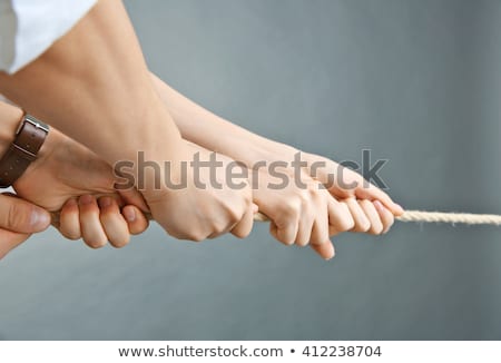 Сток-фото: Businessman Pulling Rope On Grey Background